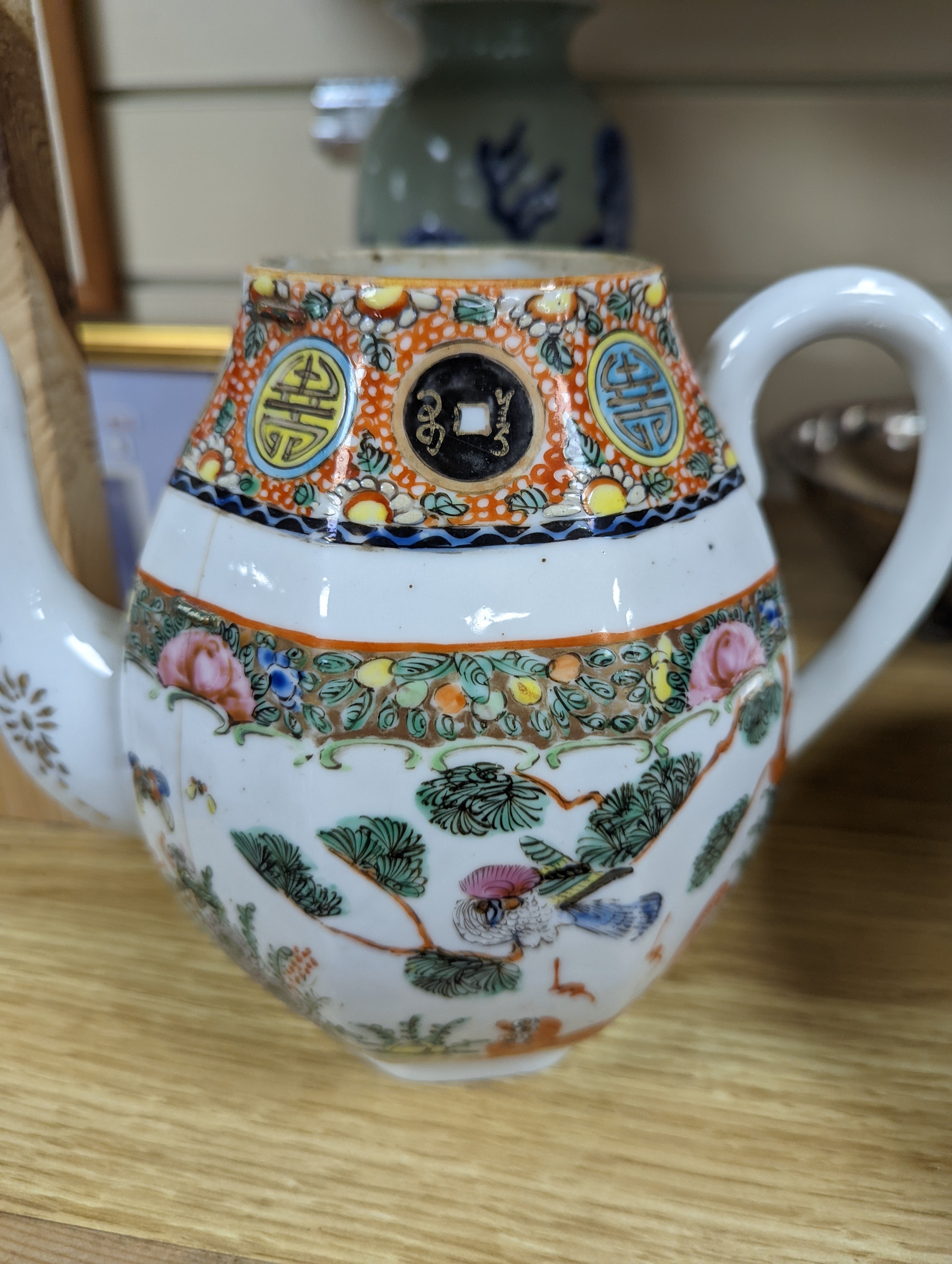 A Chinese celadon glazed vase, 24cm and a Chinese famille rose teapot and matching cream jug, a.f.
